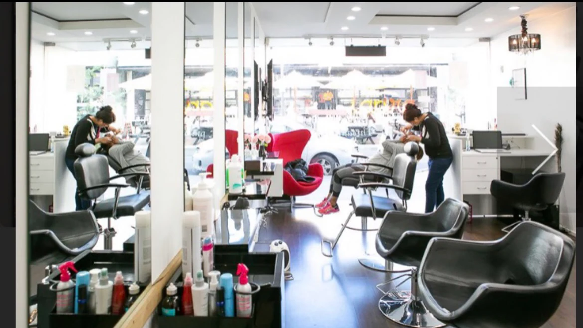 The salon floor looking out to Greville Street through the full-width shopfront glazing