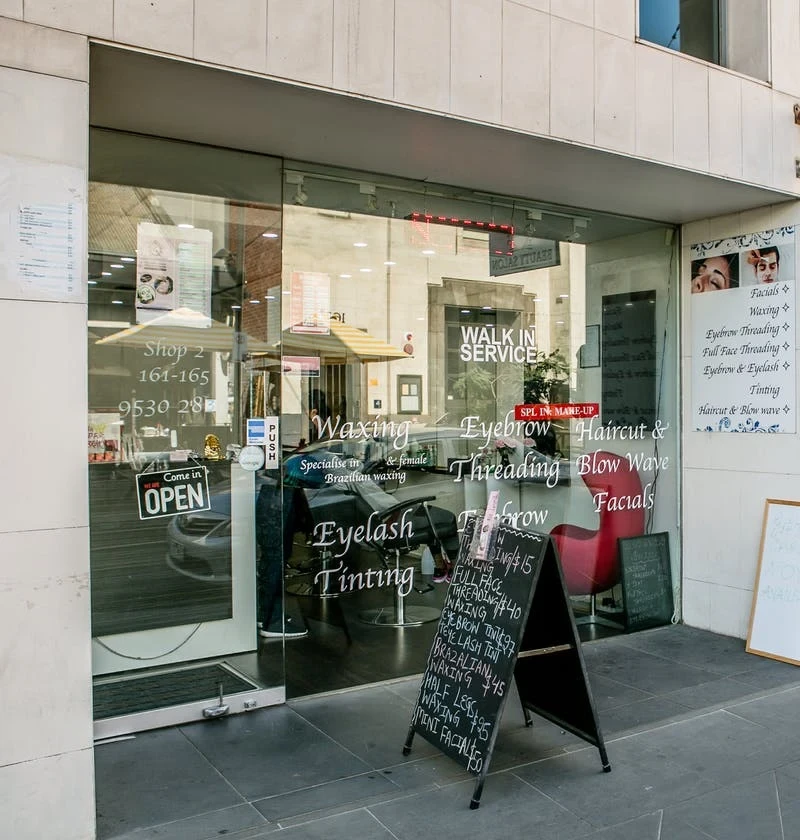 Taj Beauty Salon on Greville Street &mdash; glazed shopfront with Walk-In Service lettering