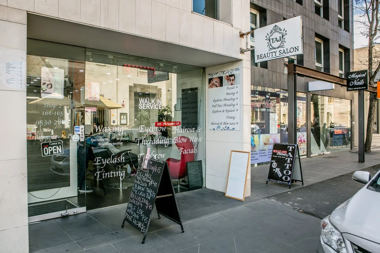 Taj Beauty Salon shopfront in sunlight on Greville Street, Prahran
